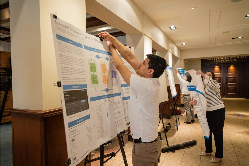 Gautam setting up his research poster